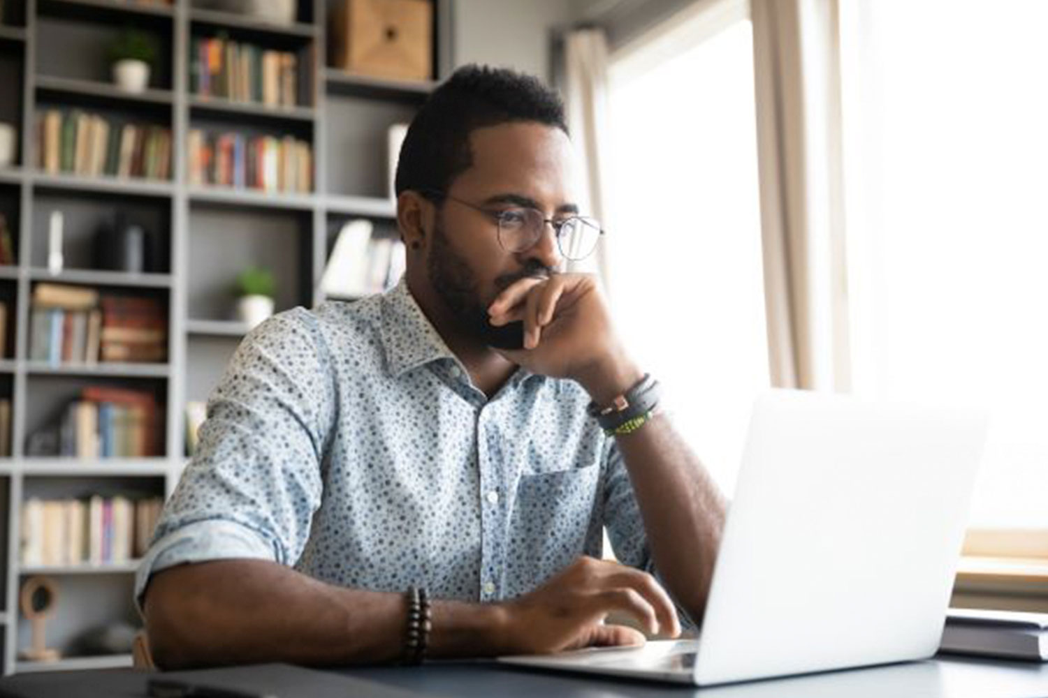 African American man working on laptop