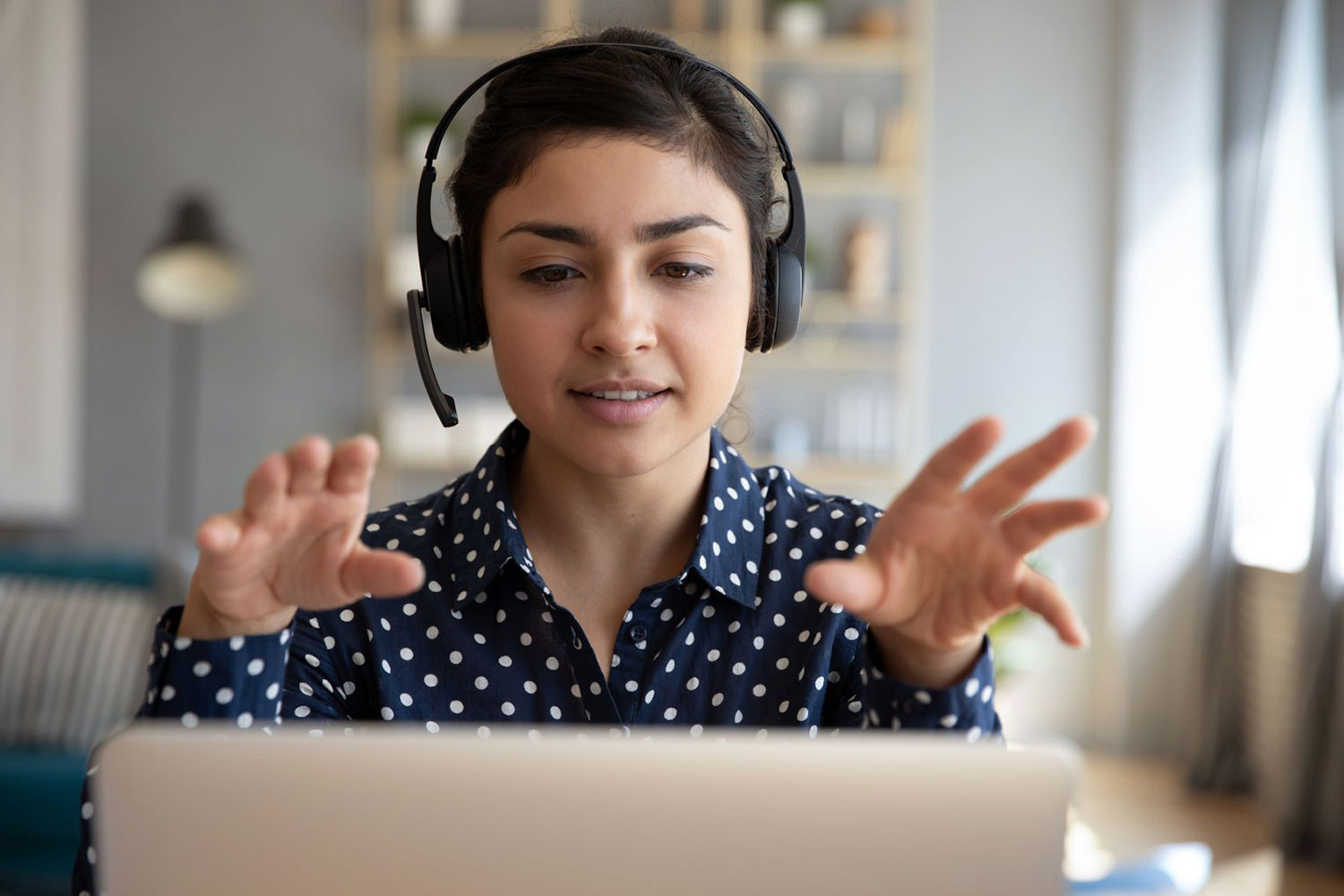 woman wearing a headset on a computer