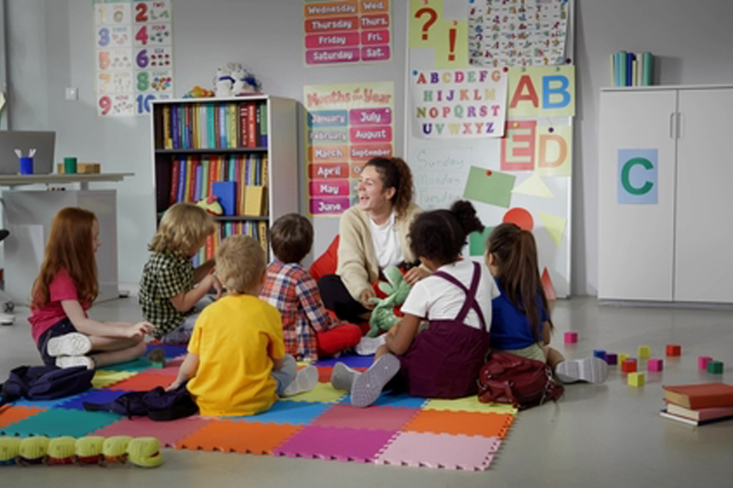 teacher reading to young children