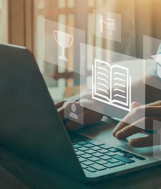 person at computer with research related icons floating in air